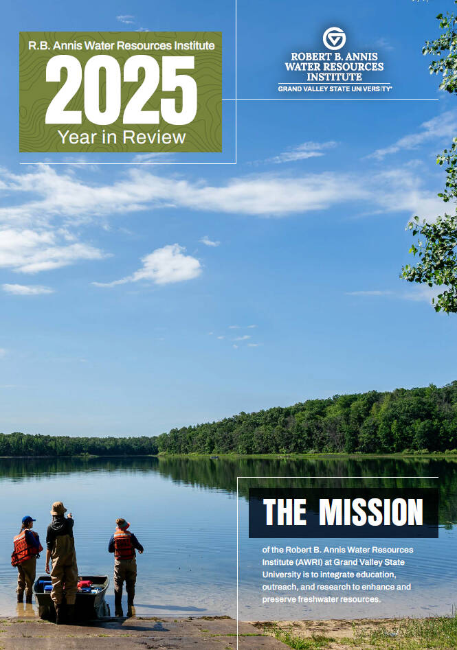 Cover of AWRI's 2025 Year In Review magazine, featuring 3 researchers standing by their boat looking away across an inland lake's shoreline.